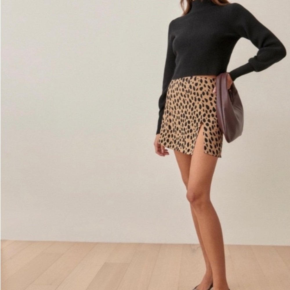Reformation “Margot” mini skirt in cheetah print.